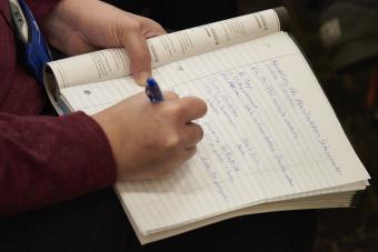 close-up shot of woman taking notes