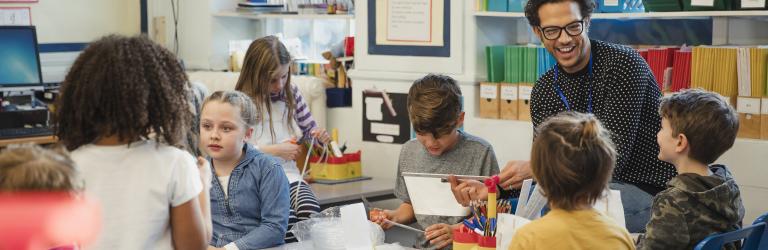 teacher with students in a classroom