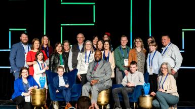 Group photo of 2024 Yes I Can Winners on the stage in Baltimore, MD, at the 2025 CEC Convention