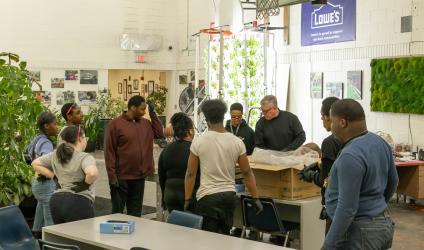 Photo of CEC's 2025 Teacher of the Year, Michael Craig, working with his students.