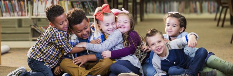 children hugging and playing